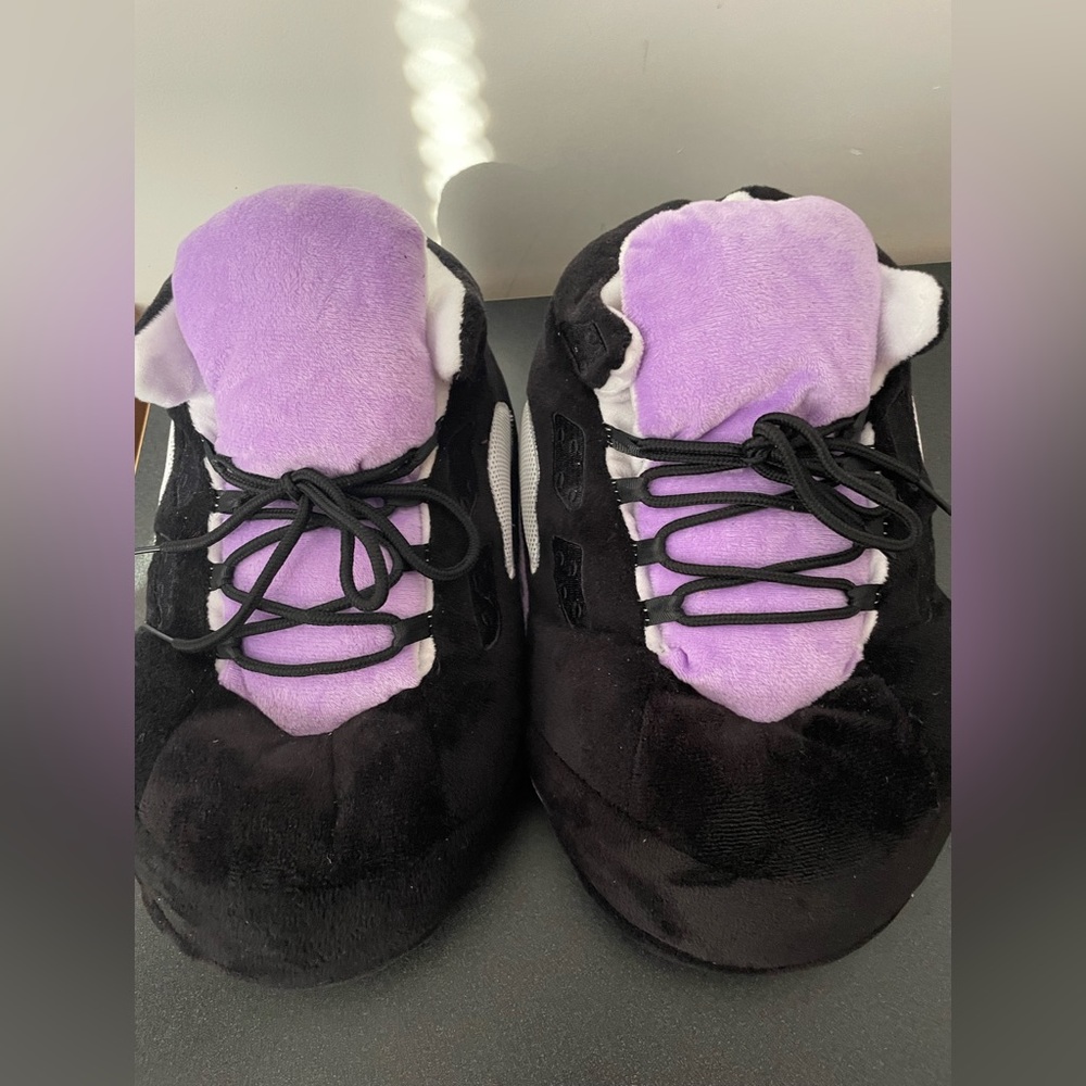 Fluffy Jordan 5 bedroom shoes , they are purple and black and they are a size 8